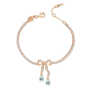 Blue Topaz Gold Bow Tennis Bracelet - Alice | LOVE BY THE MOON